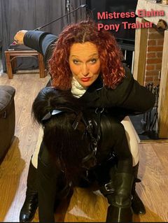 Mistress Elaina riding a pony